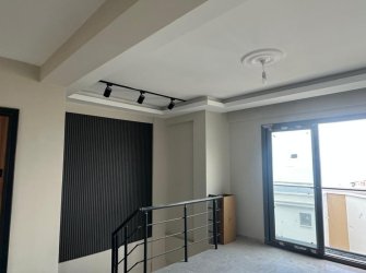 GÜLLÜK MERKEZDE DENİZ MANZARALI BAHÇE KULLANIMLI DAİRE