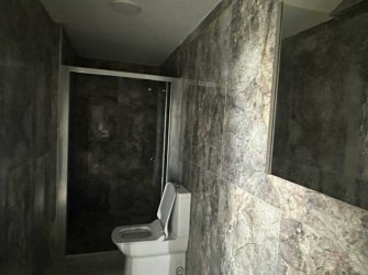 GÜLLÜK MERKEZDE DENİZ MANZARALI BAHÇE KULLANIMLI DAİRE