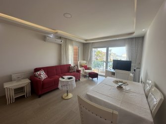 GÜLLÜK'TE DENİZ MANZARALI EŞYALI 2+1 DAİRE