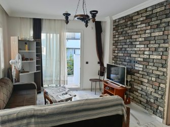GÜLLÜK'TE BALKONLU 1+1 SATILIK DAİRE